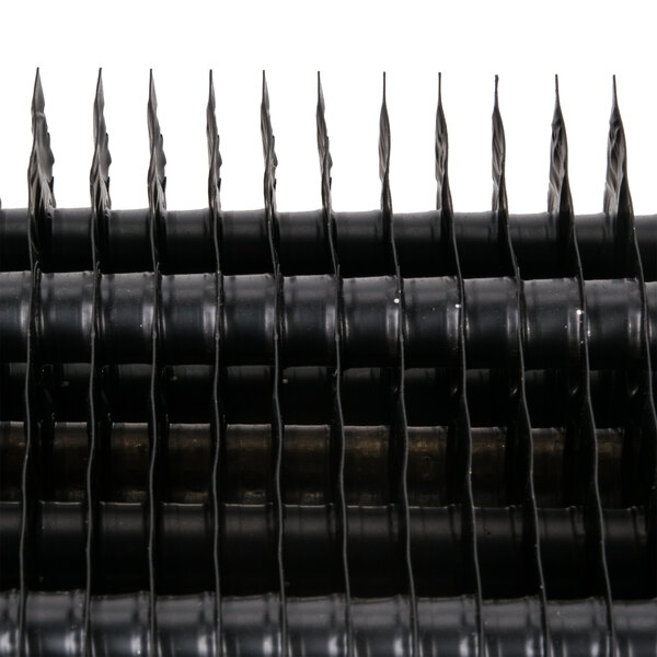 A close up of an Avantco evaporator coil. Black plastic blades are visible.
