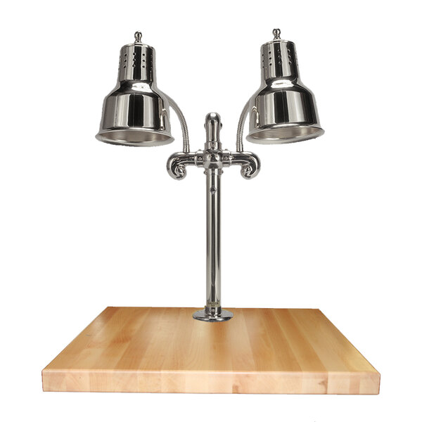 A Hanson Heat Lamps dual lamp chrome carving station on a wooden surface.