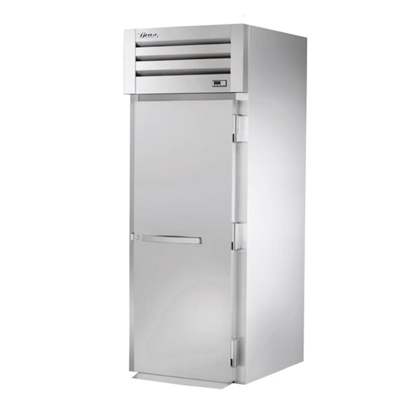 A True stainless steel roll-in freezer with a solid door.