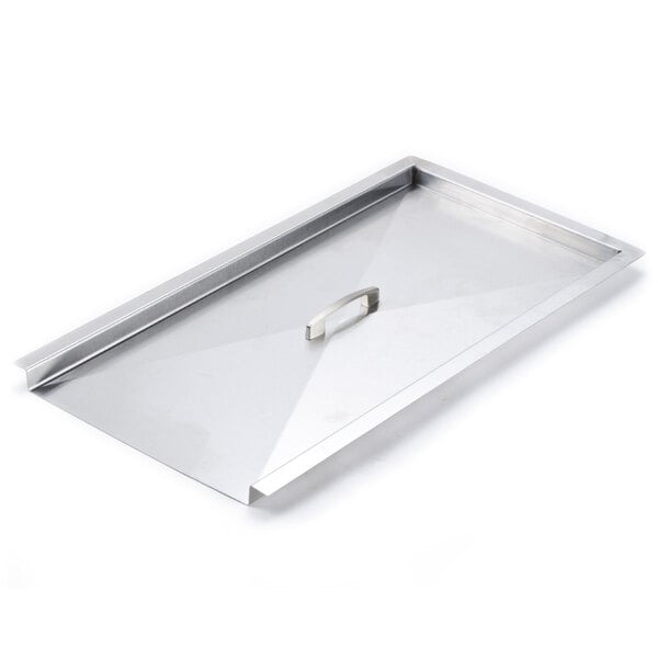 A metal tray with a silver handle.