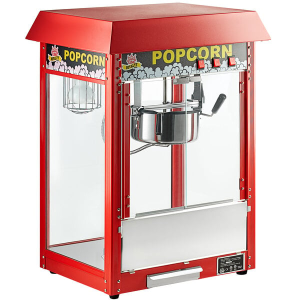 A red Carnival King popcorn machine with a glass door.