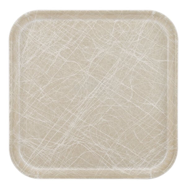 A white square Cambro fiberglass tray with an abstract tan pattern.