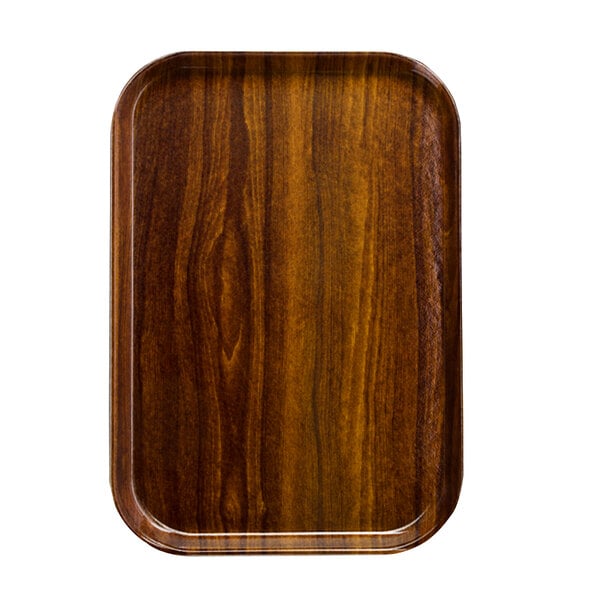 A rectangular wooden Cambro tray insert with a dark wood finish.