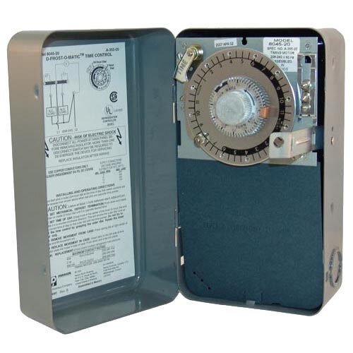 An open metal box with a dial for the All Points 42-1443 Defrost Control Timer.