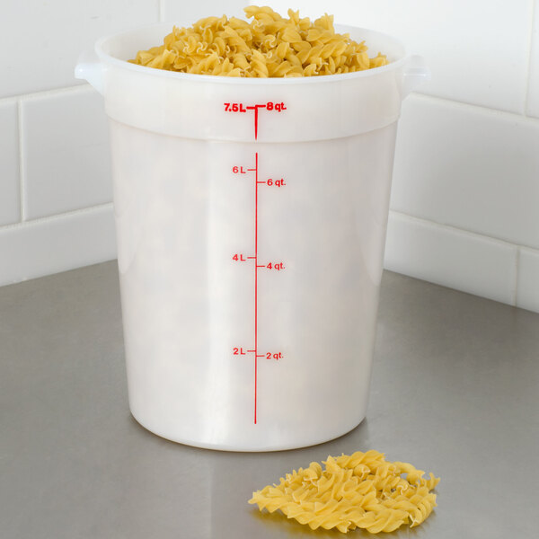 A Cambro white polyethylene food storage container filled with pasta.