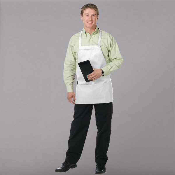 A man wearing a Chef Revival white apron with 3 pockets.