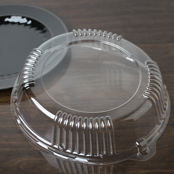 A WNA Comet plastic container lid for a black plate.