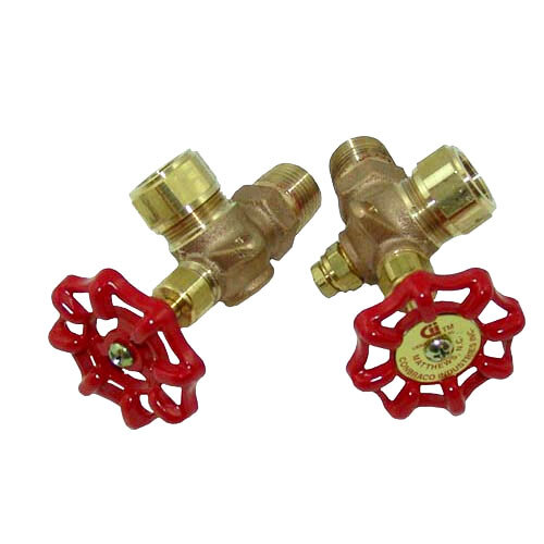 A pair of brass valves with red handles.