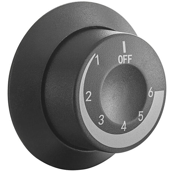 A black round knob with white text and a white number on it.