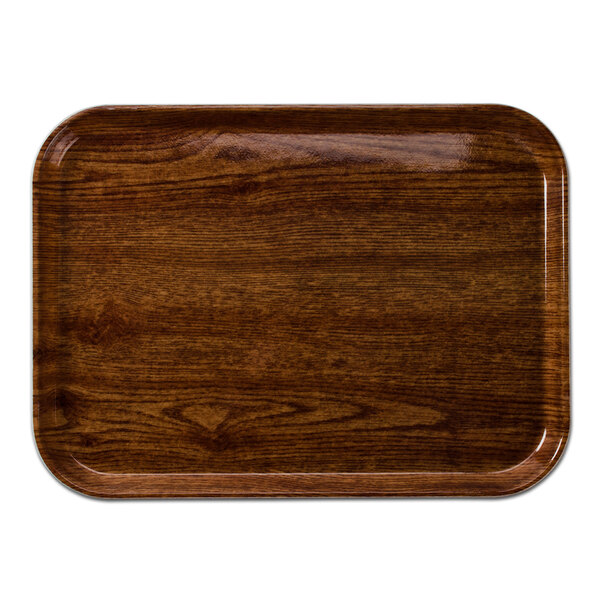 A rectangular Cambro Country Oak fiberglass tray with a wood finish.