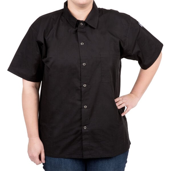 A woman wearing a black Chef Revival cook shirt.