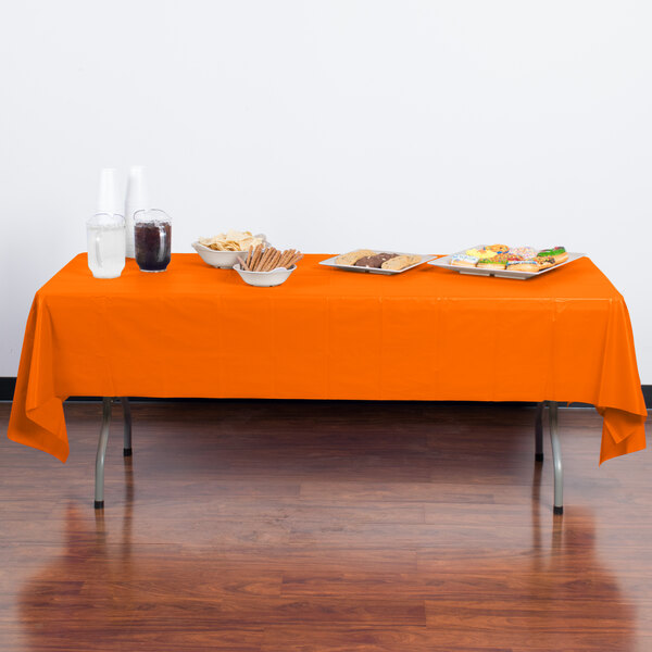 Creative Converting 01192B 54" x 108" Sunkissed Orange Plastic Table Cover - 24/Case