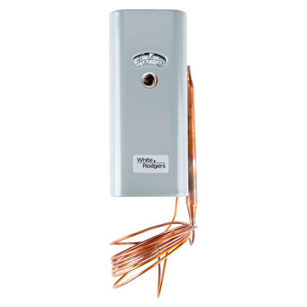 A white and silver rectangular temperature control unit with a copper wire.