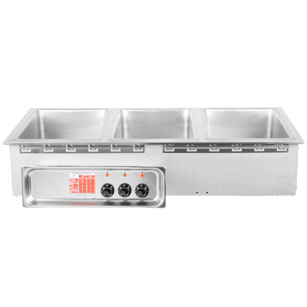 An APW Wyott stainless steel drop-in hot food well with three compartments.