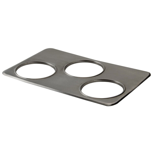 A stainless steel metal plate with three circles.