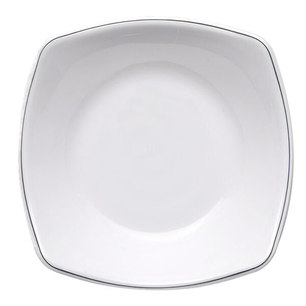 A white square melamine entree plate with black trim.