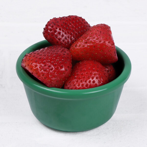 A bowl of strawberries in a green Elite Global Solutions melamine ramekin.