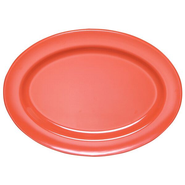 An orange oval melamine platter with a pink circle in the center.