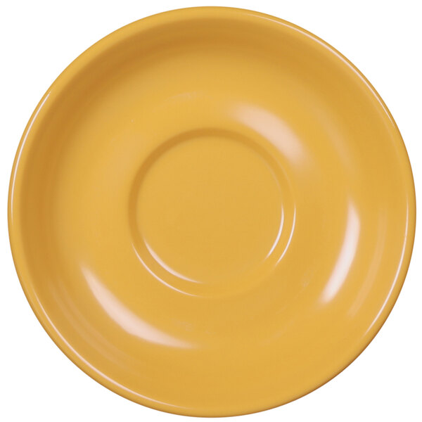 A yellow saucer with a circle in the middle.