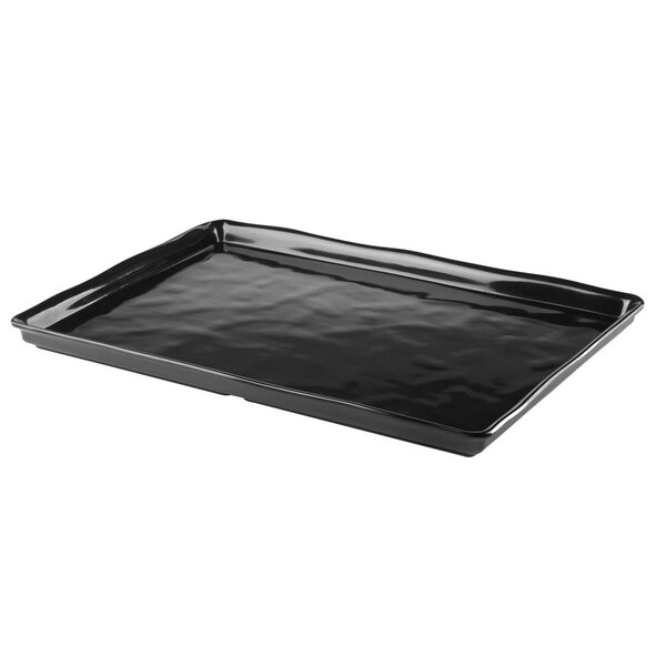An Elite Global Solutions black rectangular melamine tray with an organic edge.
