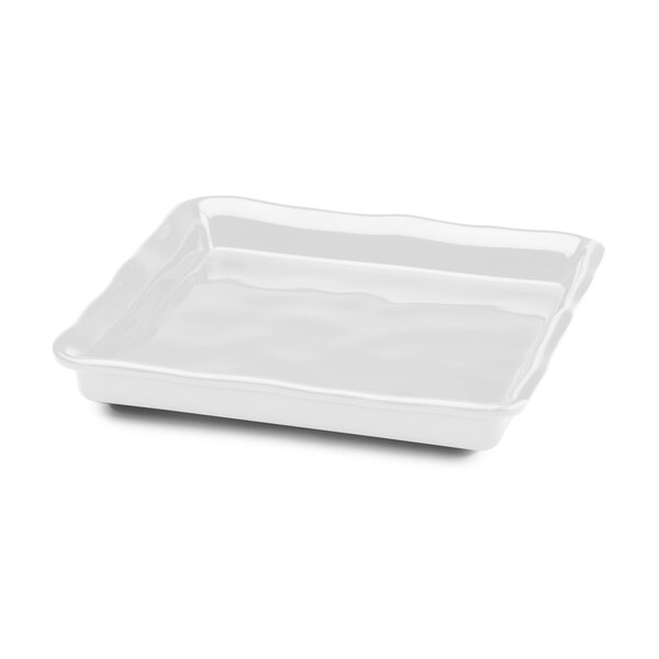A white square melamine tray with wavy edges.