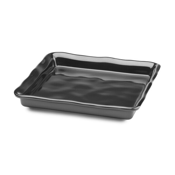 A black square tray with wavy edges.