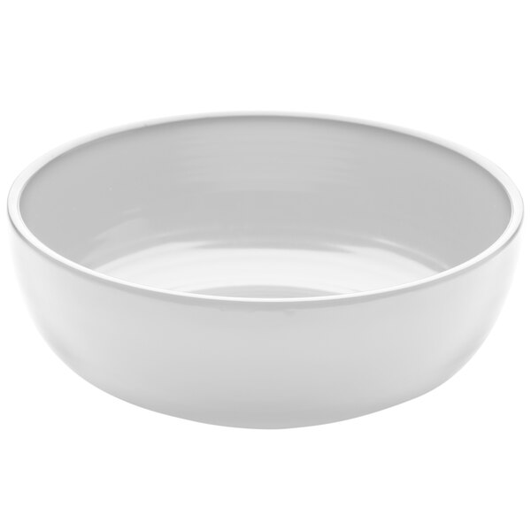 An Elite Global Solutions white melamine round ring bowl on a white surface.