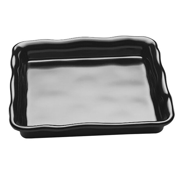 A black square tray with wavy edges.