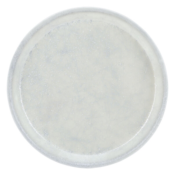 A white round Cambro tray with a speckled surface.