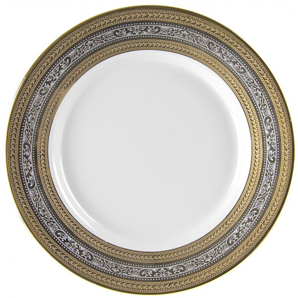 A close up of a white 10 Strawberry Street Elegance porcelain charger plate with gold trim.