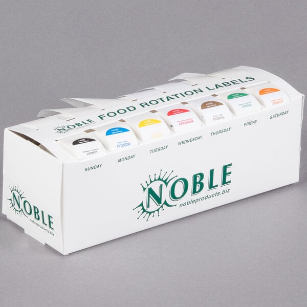 A white box of Noble Products 1" Day of the Week food rotation labels in different colors.