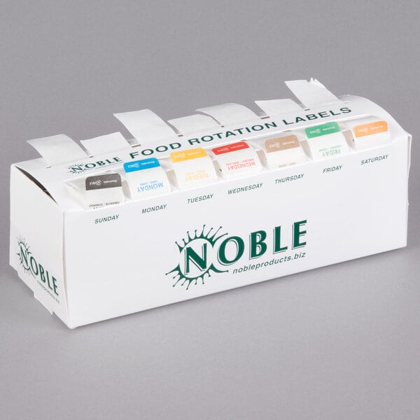 A white Noble Products dispenser box with 7 different colored food labels.