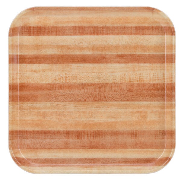 A square wooden tray with a striped pattern.