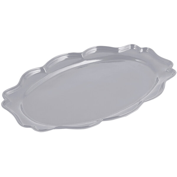 A silver Bon Chef pewter-glo oval platter with a scalloped edge.