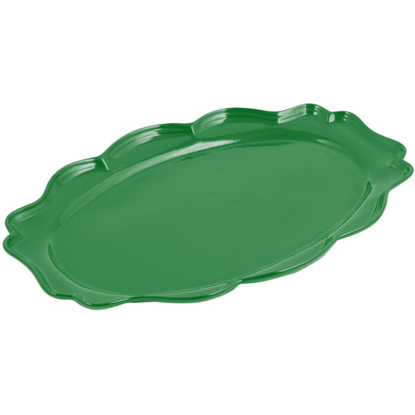 A Bon Chef Calypso Green sandstone finish oval platter with a scalloped edge.