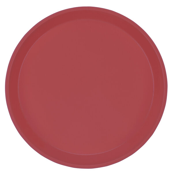 A raspberry cream colored Cambro round fiberglass tray with a white background.