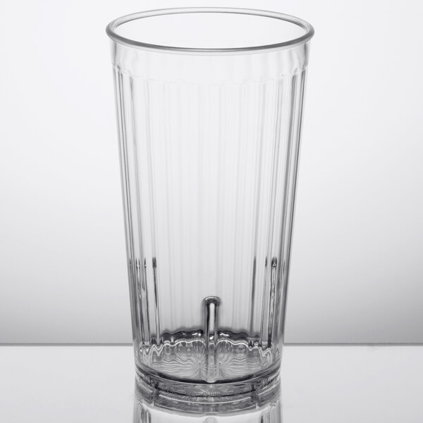 A clear plastic tumbler with a straight rim.