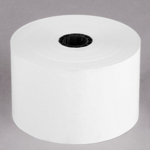 A roll of white Point Plus thermal paper with a black core.