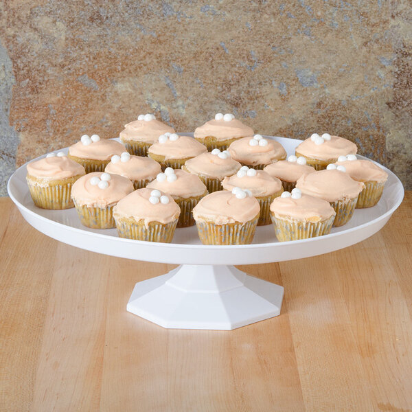 A Fineline white cake stand with cupcakes on it.