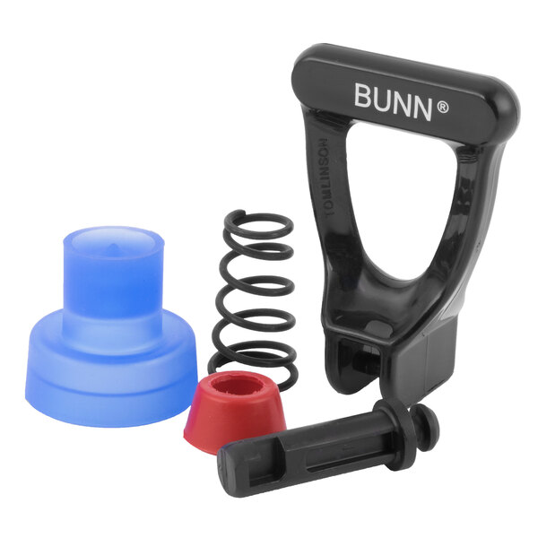 A black plastic and metal faucet repair kit with a red and black spring inside.
