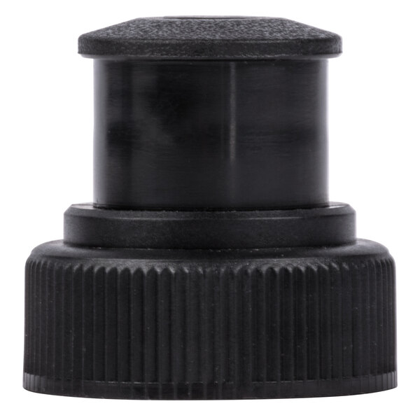 A close-up of a black plastic cap on a white surface.