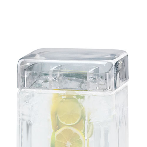 A clear glass lid on a Cal-Mil beverage dispenser with lemon slices.