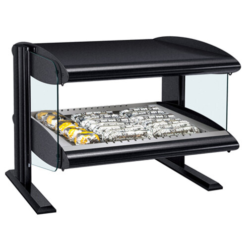 A black Hatco countertop food warmer with a glass top and food on a shelf.