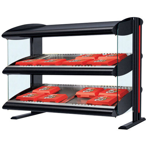 A black Hatco display case with red food trays on a countertop.