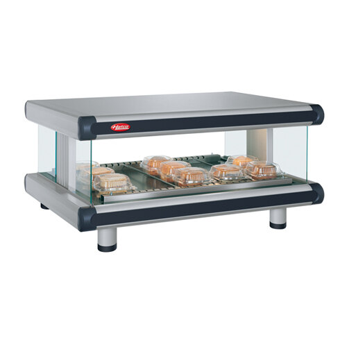 A Hatco countertop food warmer with trays of food inside.