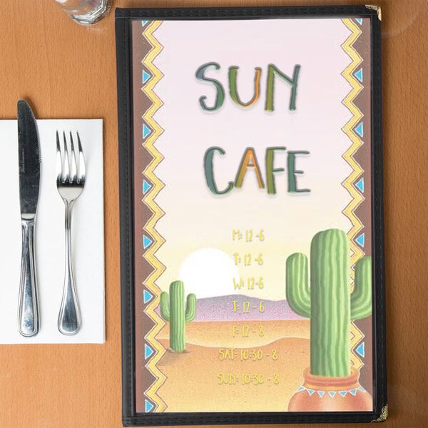 Menu cover with a southwest themed cactus design on a table.