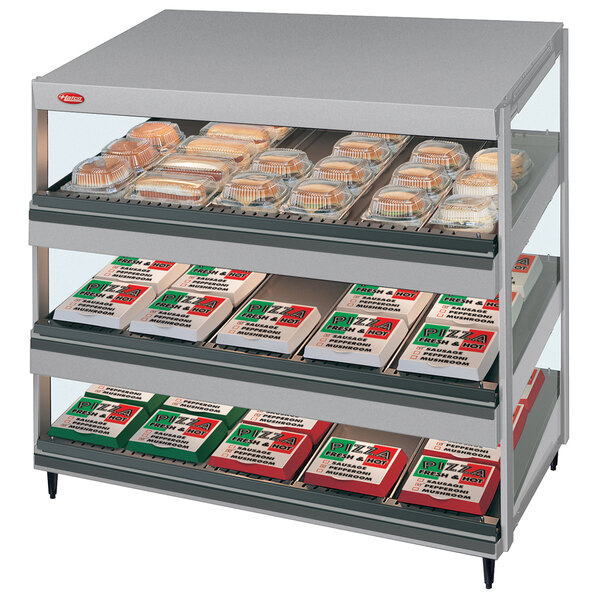 A Hatco countertop display shelf with food on it.
