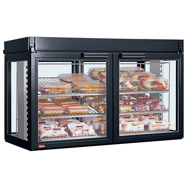 A Hatco Flav-R-Savor large capacity countertop merchandising cabinet with food inside.