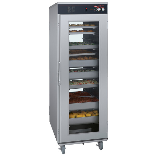 A large stainless steel Hatco Flav-R-Savor holding cabinet with trays of food inside.
