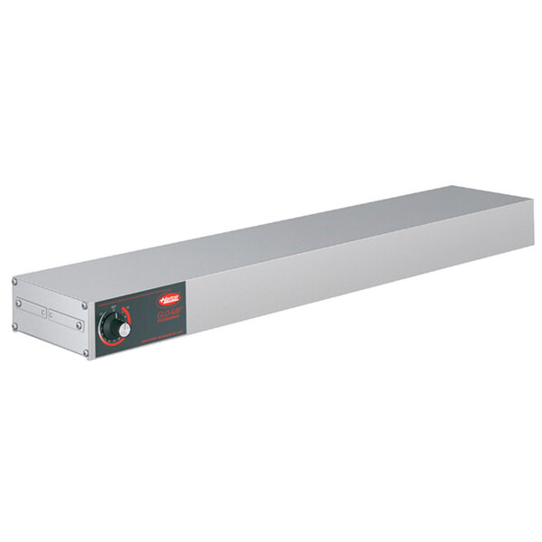 A long rectangular stainless steel box with a red light and knob on it.